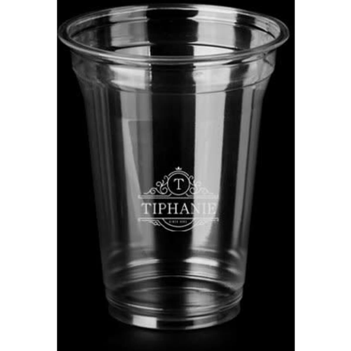 A clear 17 oz PET coffee cup with a lid, featuring a logo, showcased against a dark background.