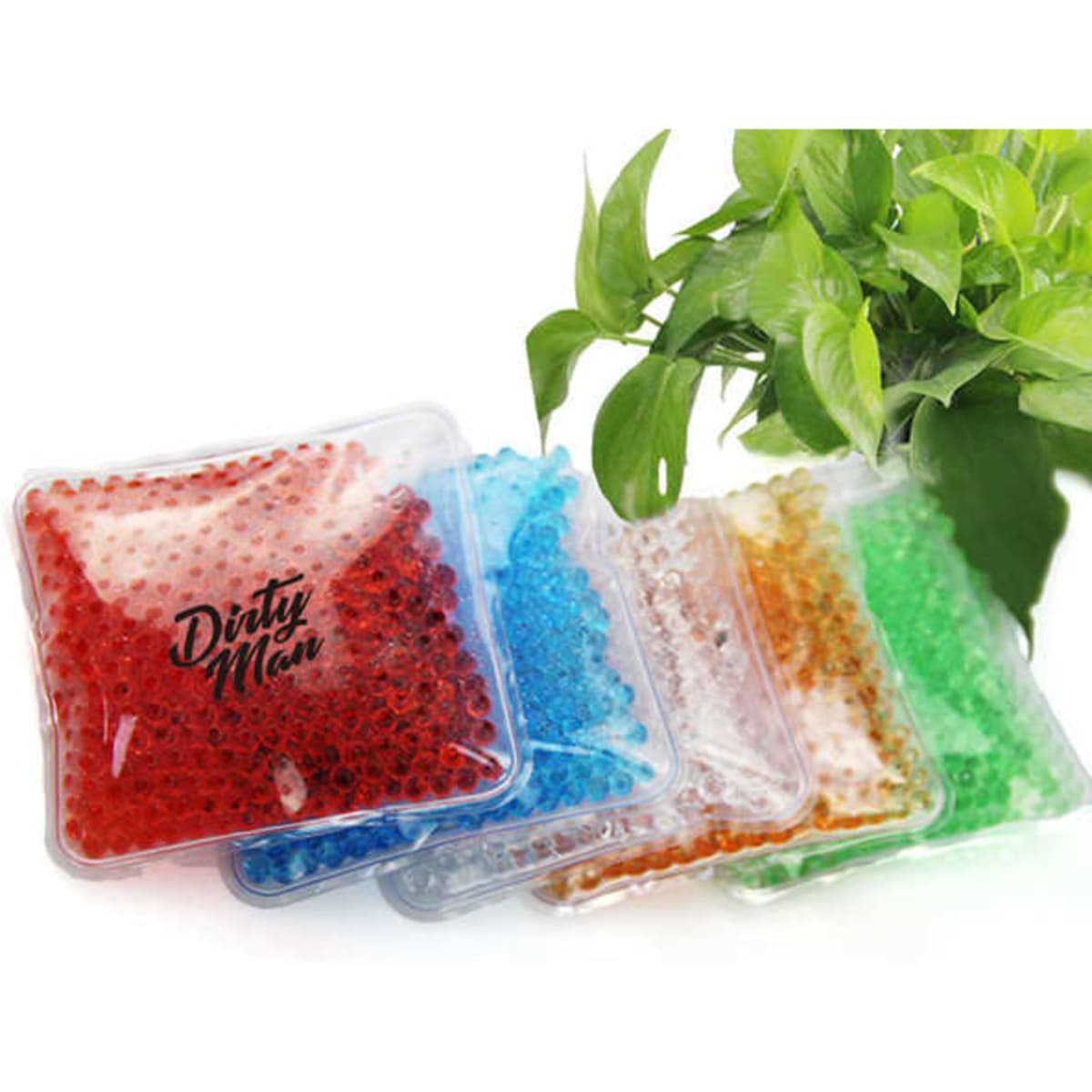 Five square gel bead ice packs in various colours, including red, blue, green, orange, and clear, arranged with foliage.