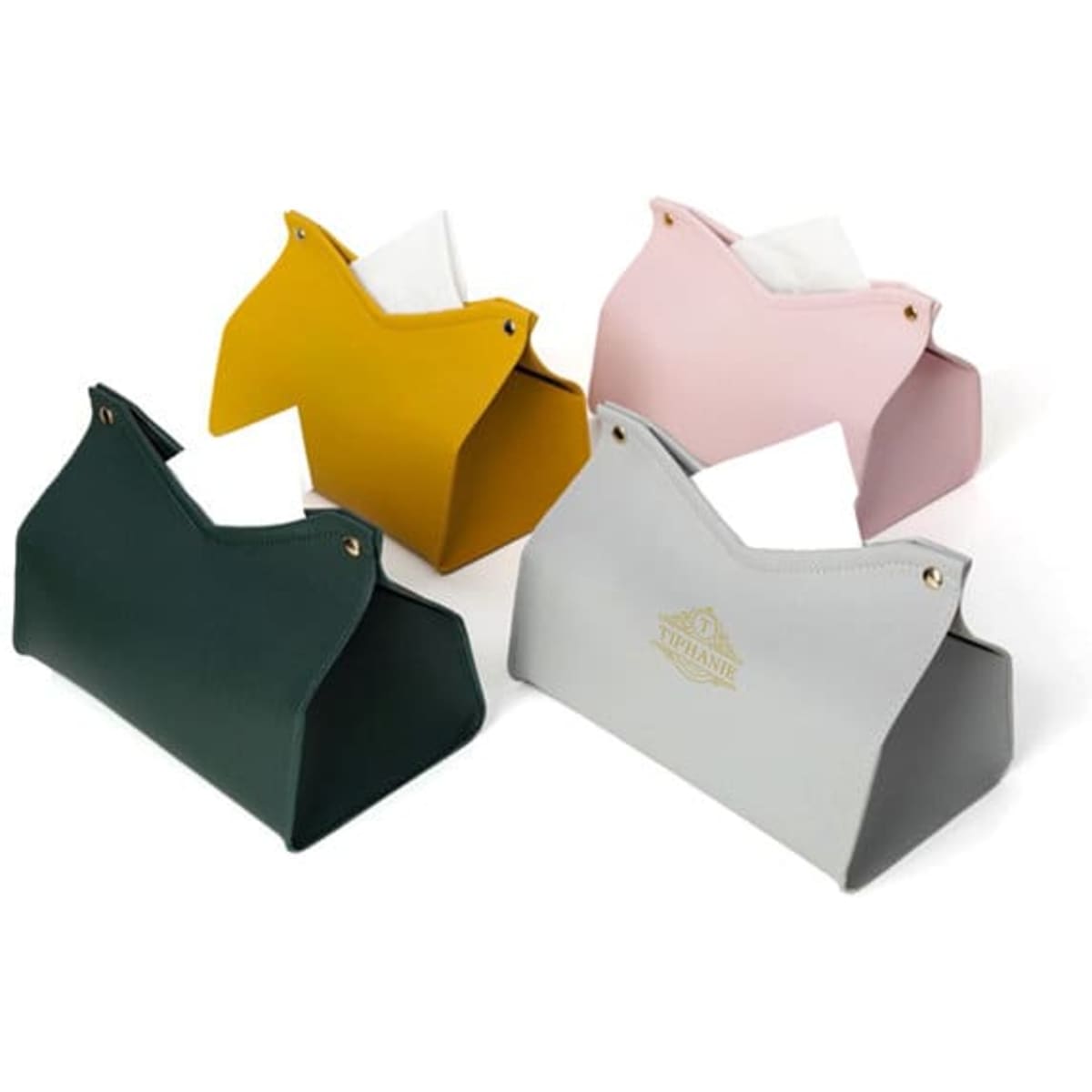 A set of four PVC leather tissue boxes in green, yellow, pink, and grey, featuring decorative logos.