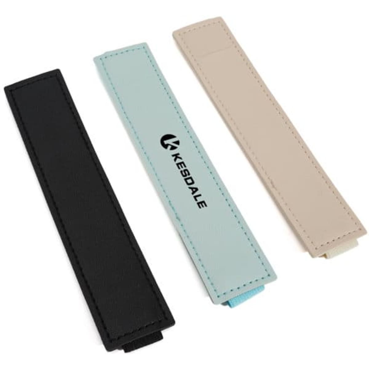 A set of three notebook pen holders in black, light blue, and beige, featuring a logo on one holder.