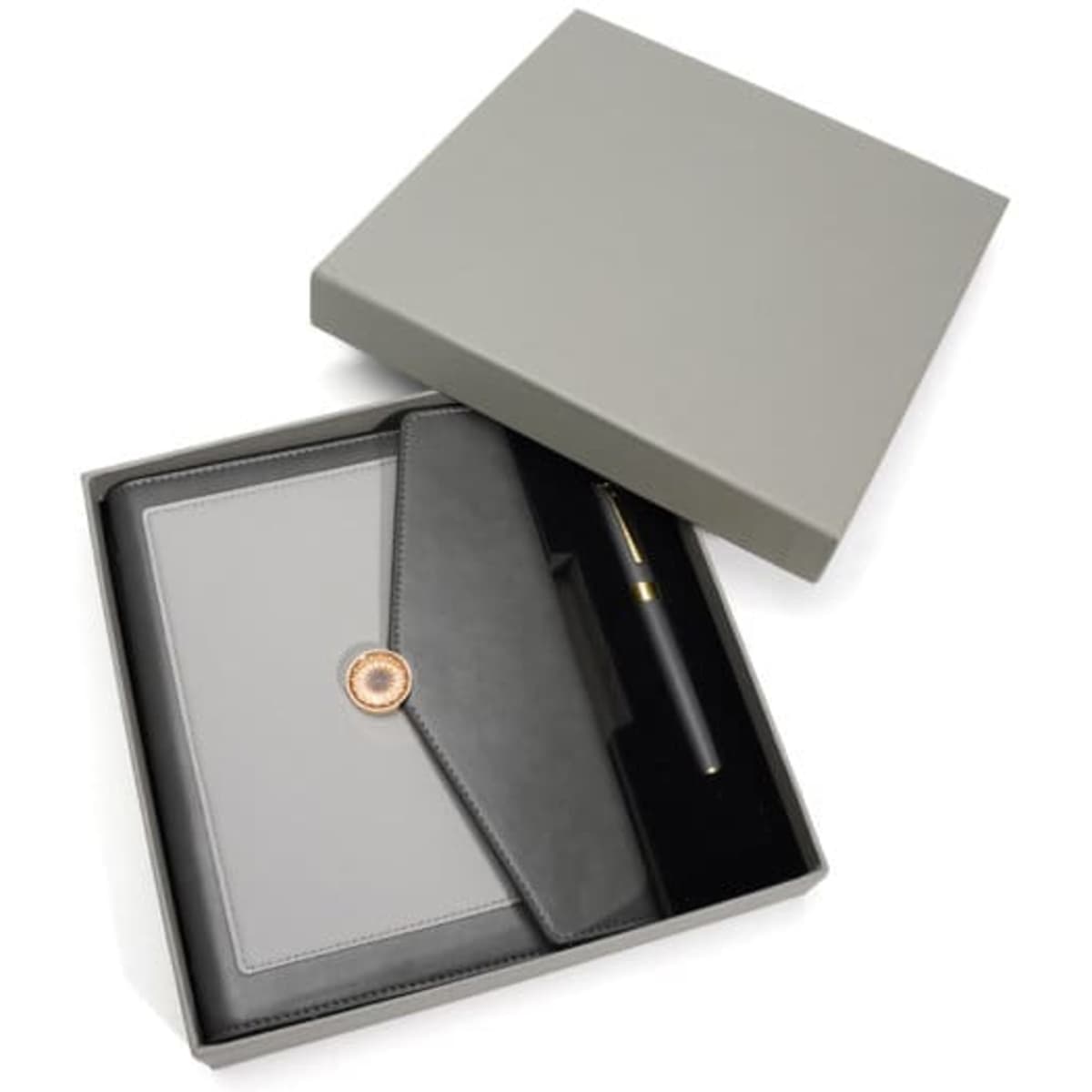 A grey spiral notebook gift set in an open box, featuring a pen and a black folder.