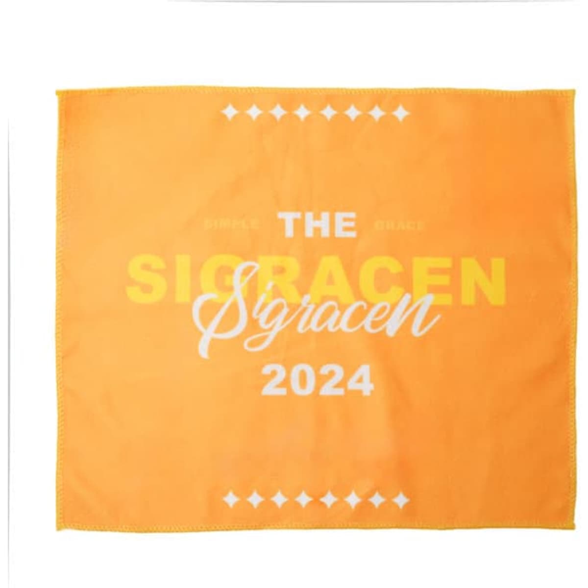 An orange microfiber towel featuring white and yellow text, with a logo in the design.