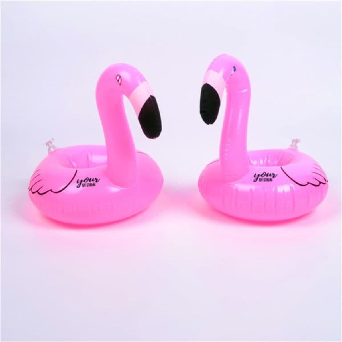 Two pink inflatable flamingo drink floats, featuring black beaks and a branding logo on each float.