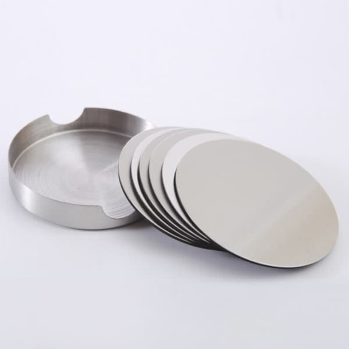 A set of stainless steel round coasters with a matching holder, featuring a shiny silver finish.