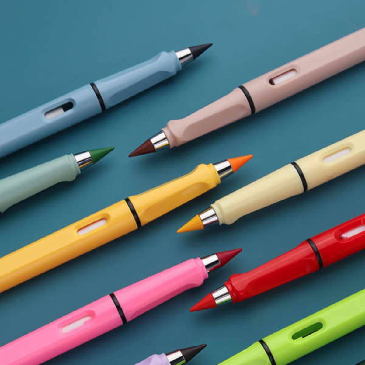 A collection of multi-coloured pencils with erasers, featuring pastel shades and a metallic accent.