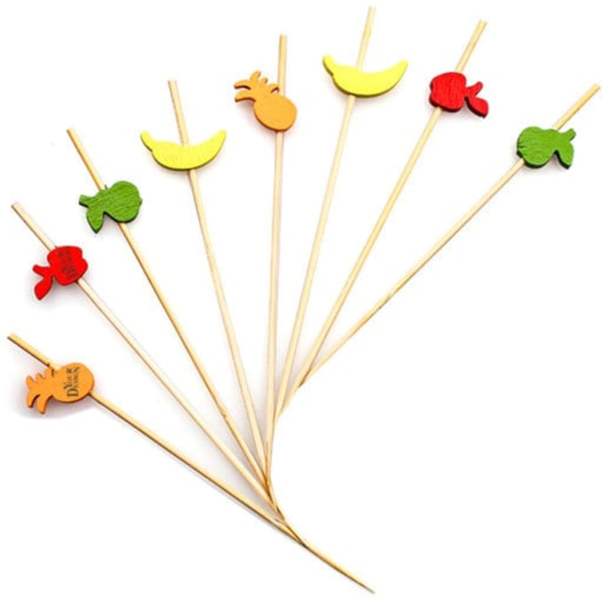 A set of wooden cocktail picks in assorted fruit shapes, featuring yellow bananas, green apples, red fish, and a pineapple.