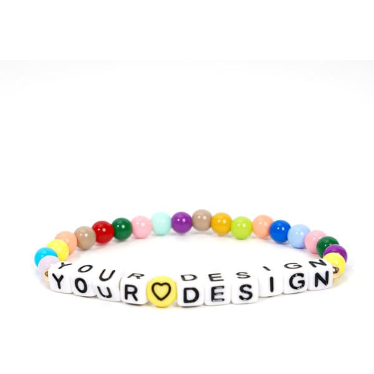 A set of three clay bead bracelets featuring colourful beads and personalised letter beads.