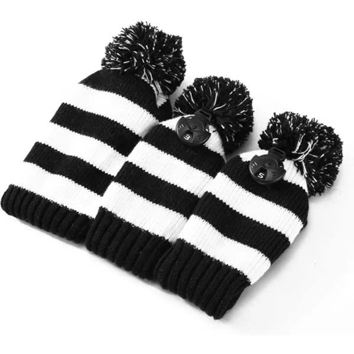 A knitted golf club head cover set in black and white stripes, featuring pom-poms on top. Comes with three sizes.