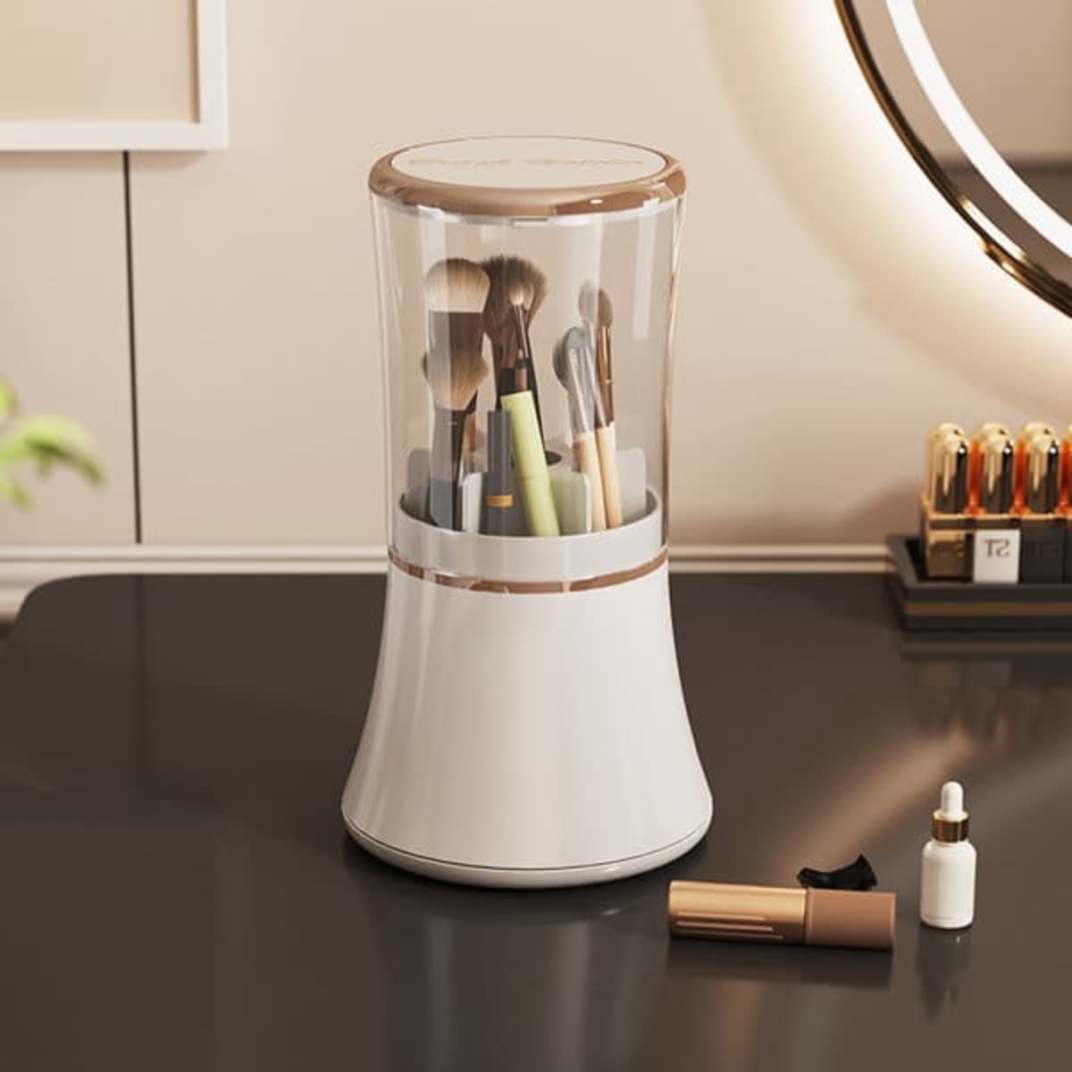 A rotating makeup brush holder in white and gold, featuring various brushes and tools inside.