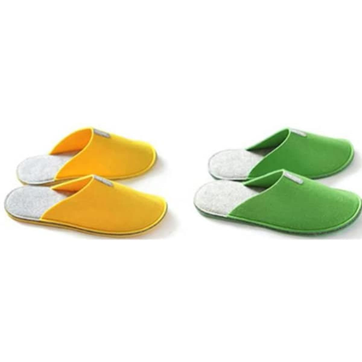 A pair of yellow and a pair of green non-slip felt slippers with grey inner lining. Each pair has a logo.