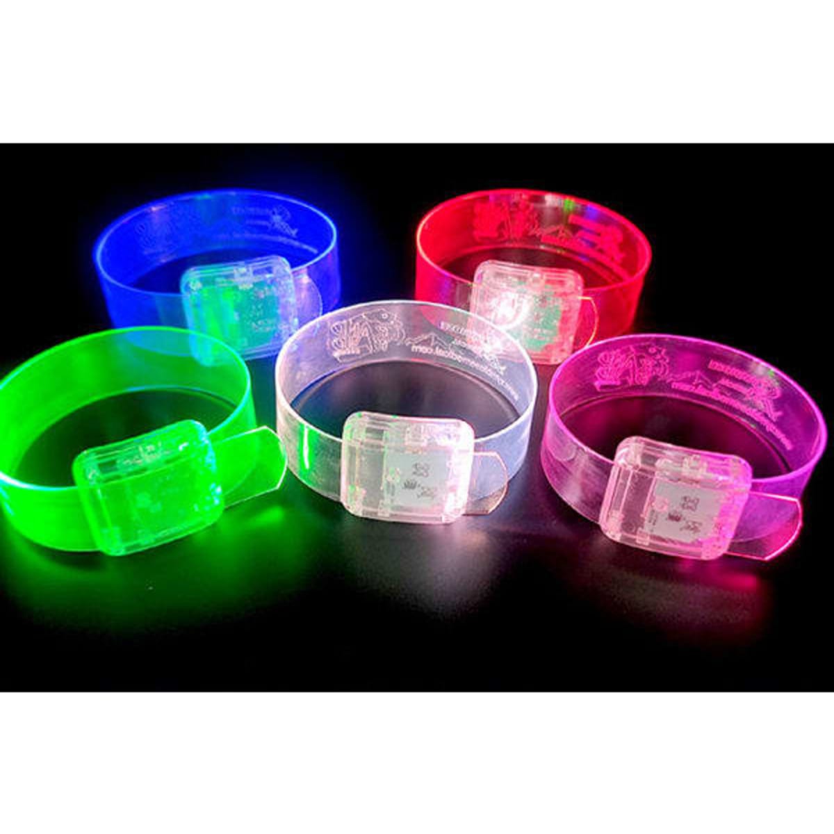 Five custom clear LED wristbands in blue, red, green, pink, and clear, each with a light-up feature and a logo.