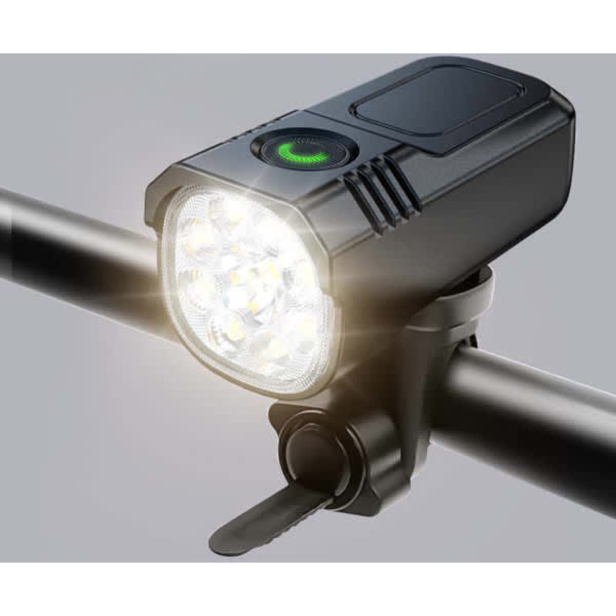 A black bicycle light with multiple LED bulbs attached to a handlebar, featuring a green power button.