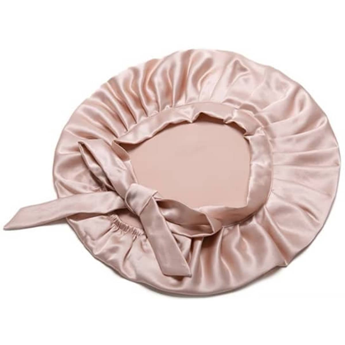 A custom silk bonnet in soft pink, featuring a gathered edge and a satin ribbon tie. It has a logo.