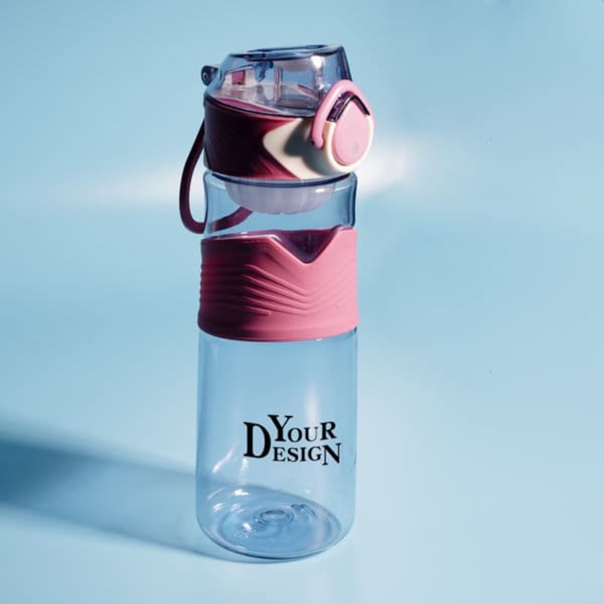 A drink bottle featuring a clear body with a pink silicone grip and a flip-top lid, along with a logo.