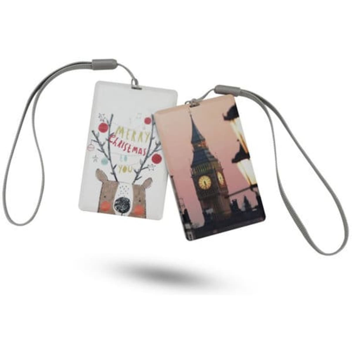 A pair of credit card-sized speakers featuring festive and iconic designs, with a grey strap for easy carrying.