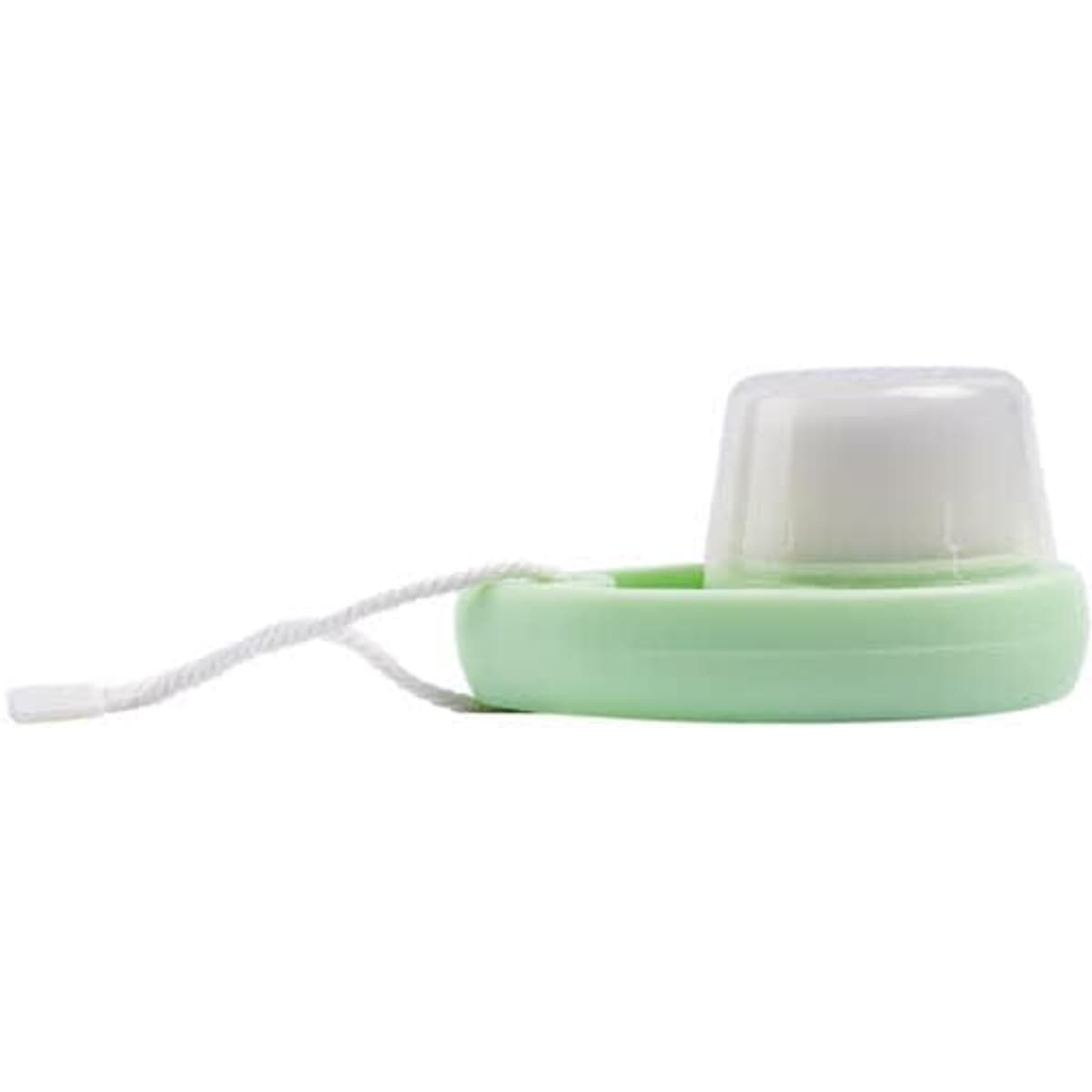A soft bristle face cleansing brush in mint green with a white bristle head and a string for hanging.