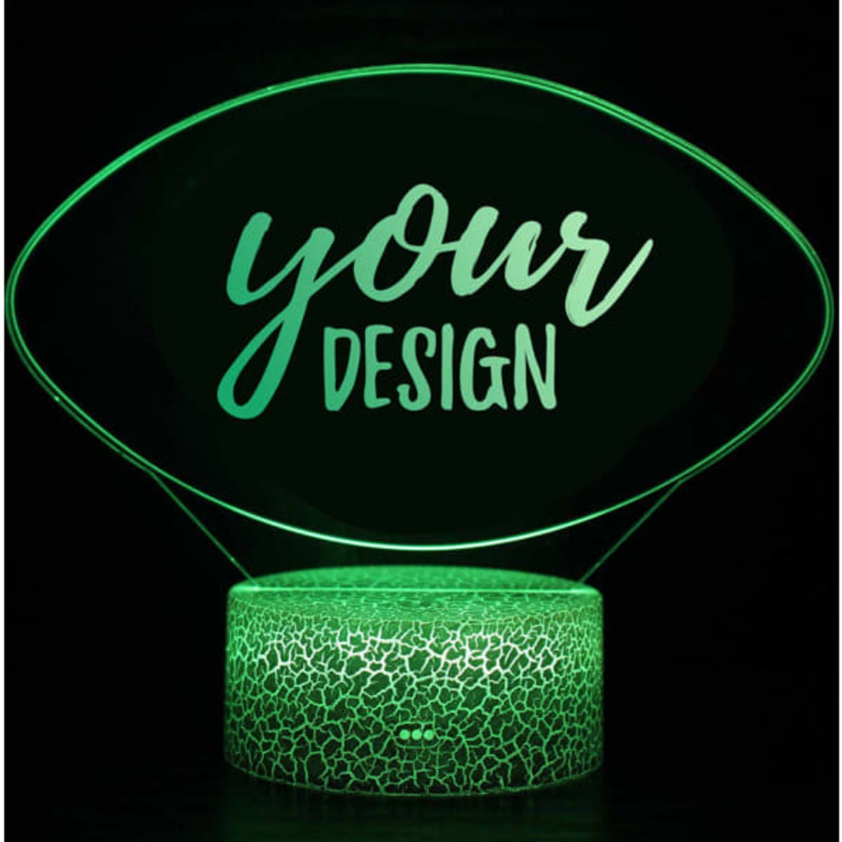 A 3D illusion LED night light featuring a clear design on a textured green base.