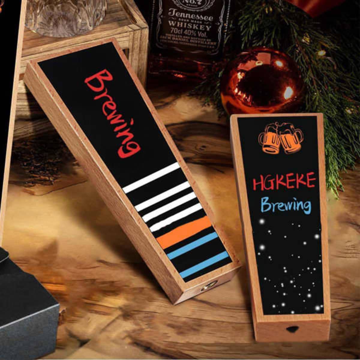 Wooden beer tap handles with chalkboard surfaces, featuring a variety of striped designs and an engraved logo.