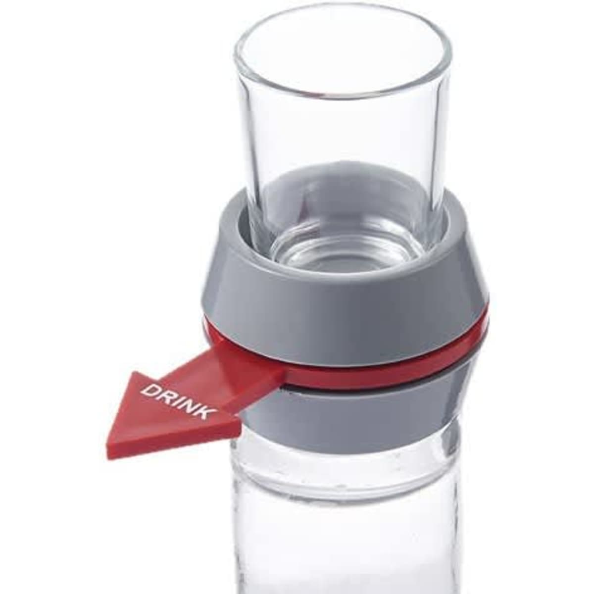 A glass shot glass with a grey and red spinner attached, featuring a directional arrow.