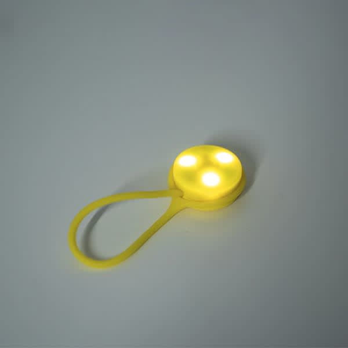 A yellow portable silicone LED backpack light featuring three illuminated bulbs and a flexible strap.