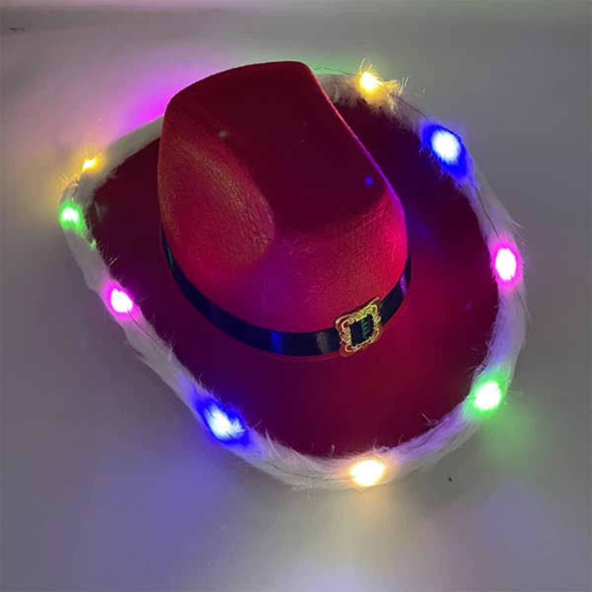 A bright red cowboy hat with a black band and multi-coloured lights around the brim.