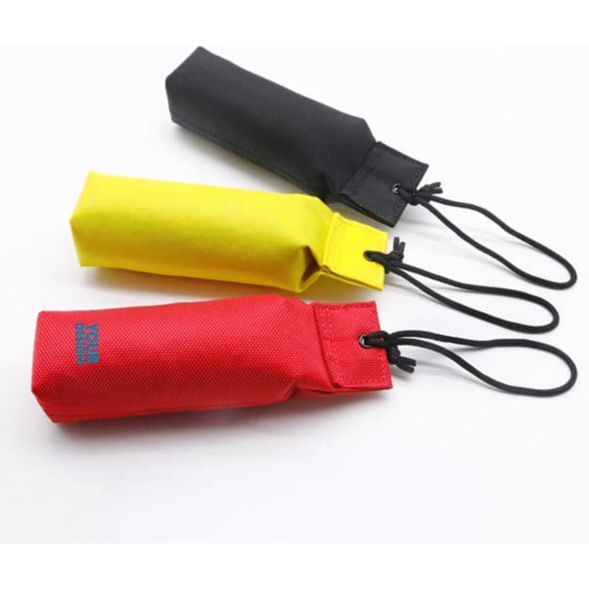 Three dog tug toys in black, yellow, and red, featuring handles and a logo on each item.