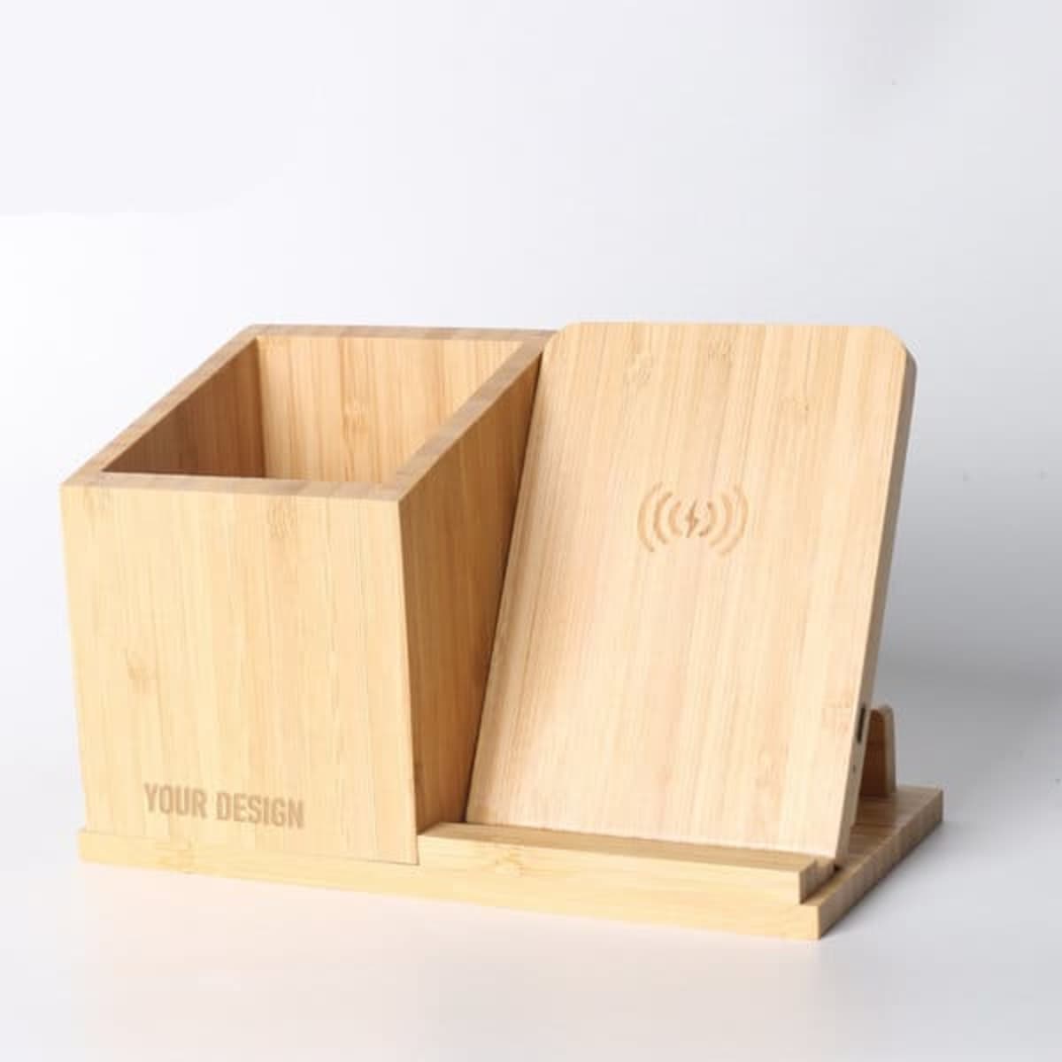 A bamboo pen holder with a wireless charger. The holder features a sleek design with a light wooden finish.
