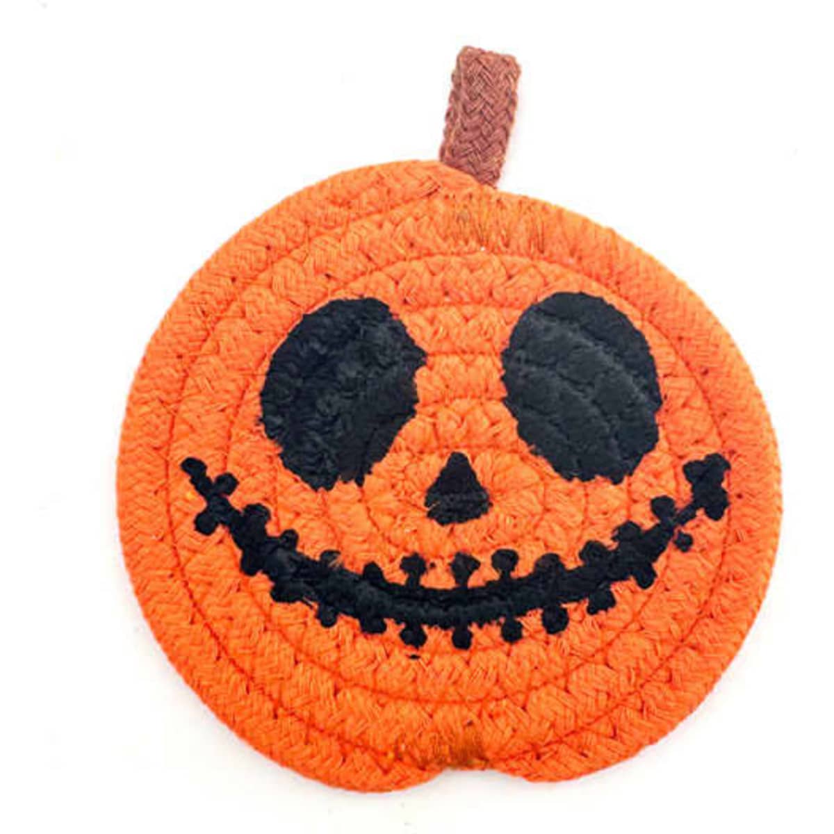 An orange Halloween pumpkin coaster with a black smiling face and stitched details, featuring a brown hanging loop.