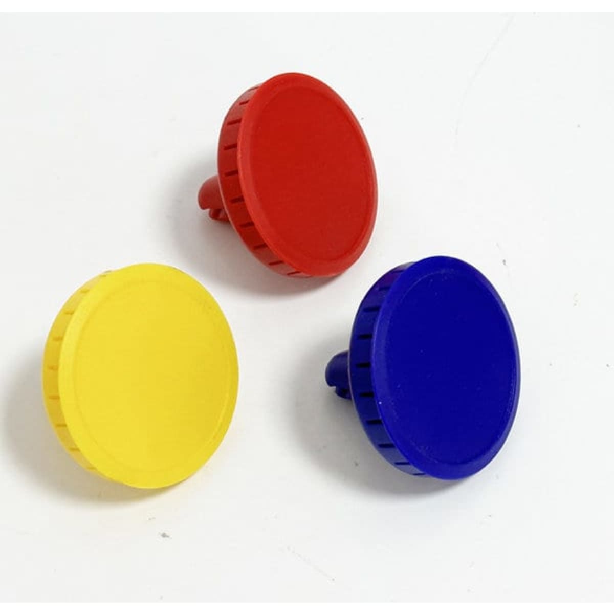 Three circular clip-on air fresheners in red, yellow, and blue on a white background, featuring a simple design.