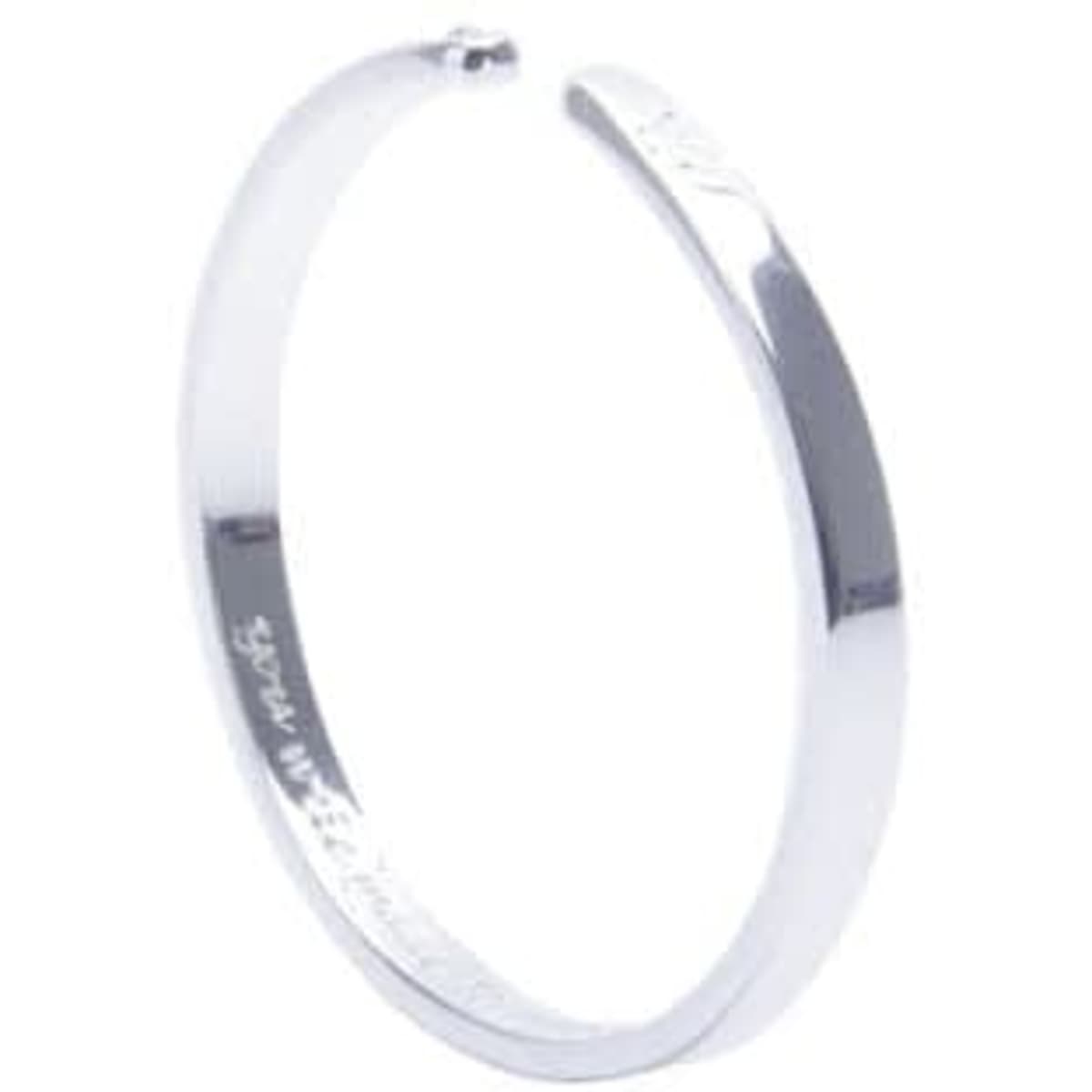 A silver cuff bracelet with a sleek, polished finish and a subtle logo.