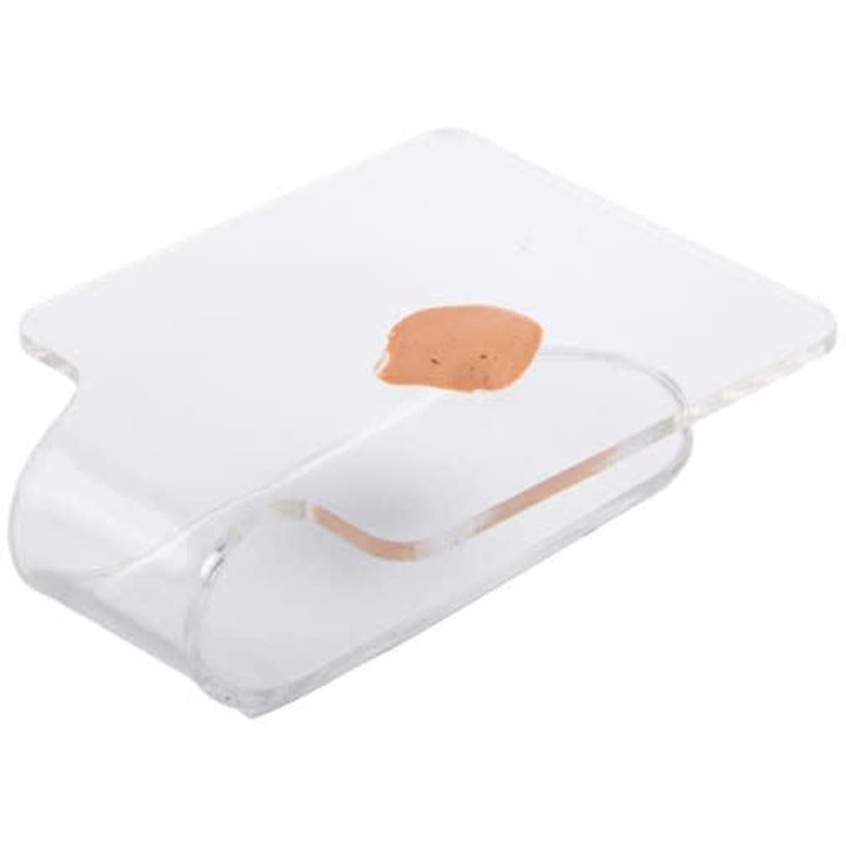 Acrylic handheld makeup palette in clear with a small swatch of makeup on its surface, featuring a sleek, rounded design.