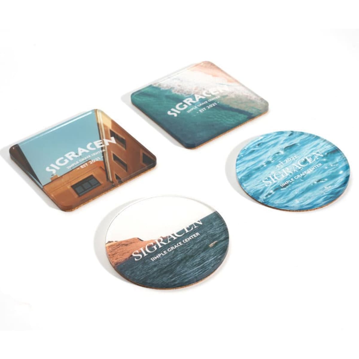 Acrylic coasters set featuring a mix of square and round designs in blue and earthy tones, each with unique imagery and branding.