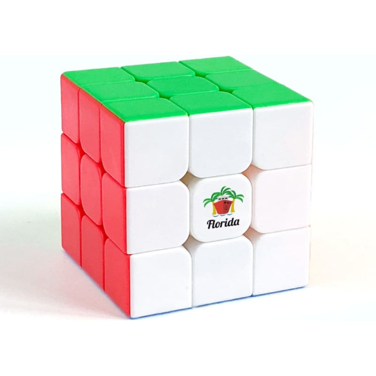 A 3x3x3 magnetic speed cube featuring green, red, and white sides, with a logo on one face.