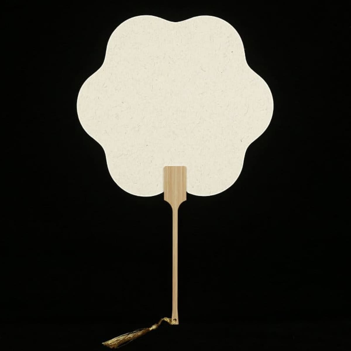 A custom bamboo hand fan in a flower shape, featuring a wooden handle and a decorative tassel, with a cream colour.