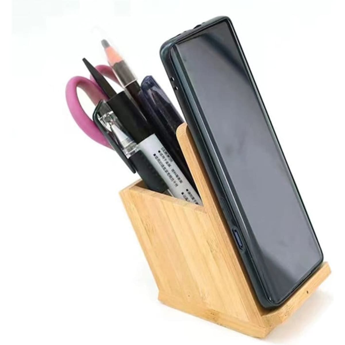 A bamboo pen holder featuring a wireless charger, holding pens, scissors, and a smartphone in an organised design.