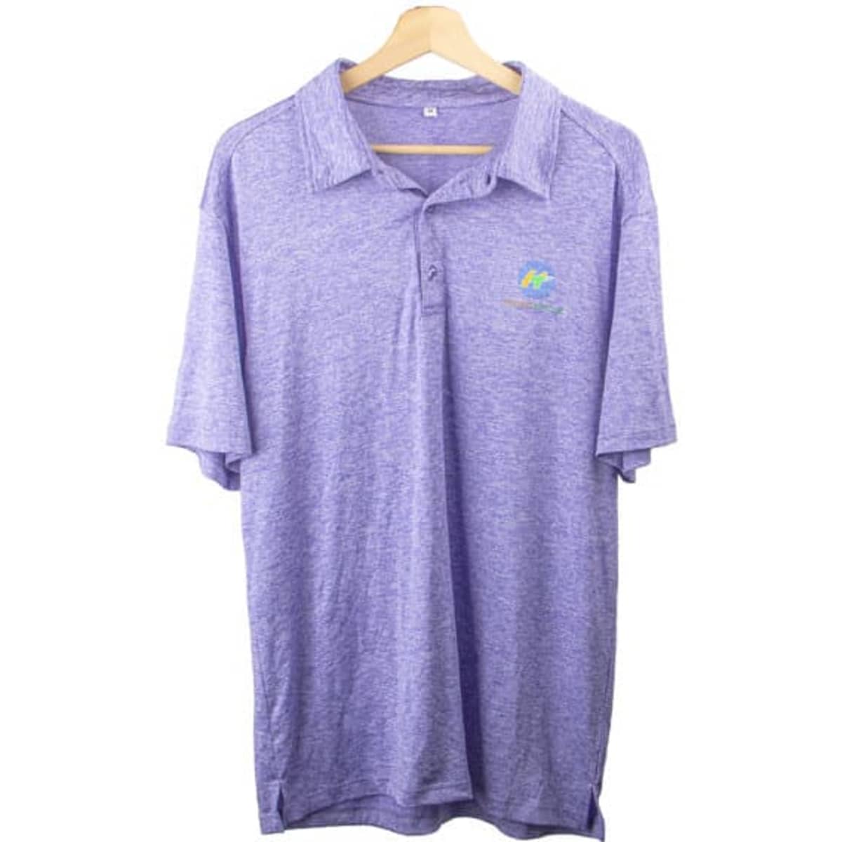 A purple quick dry polo shirt featuring a logo on the chest, displayed on a wooden hanger.