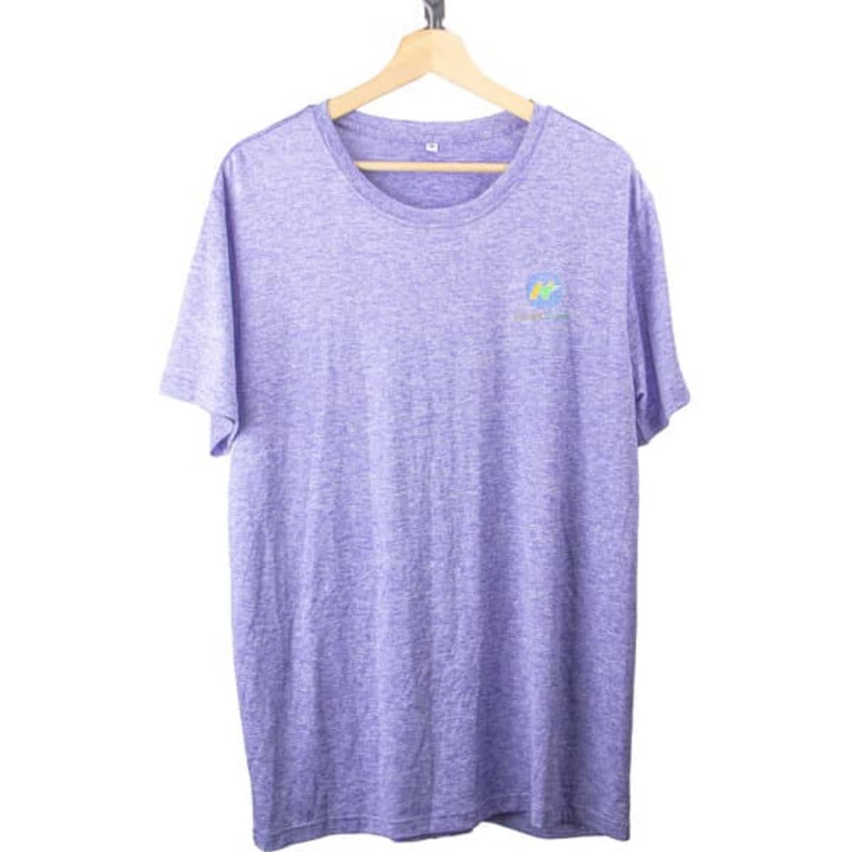 A purple short sleeve T-shirt hanging on a wooden hanger, featuring a small logo.