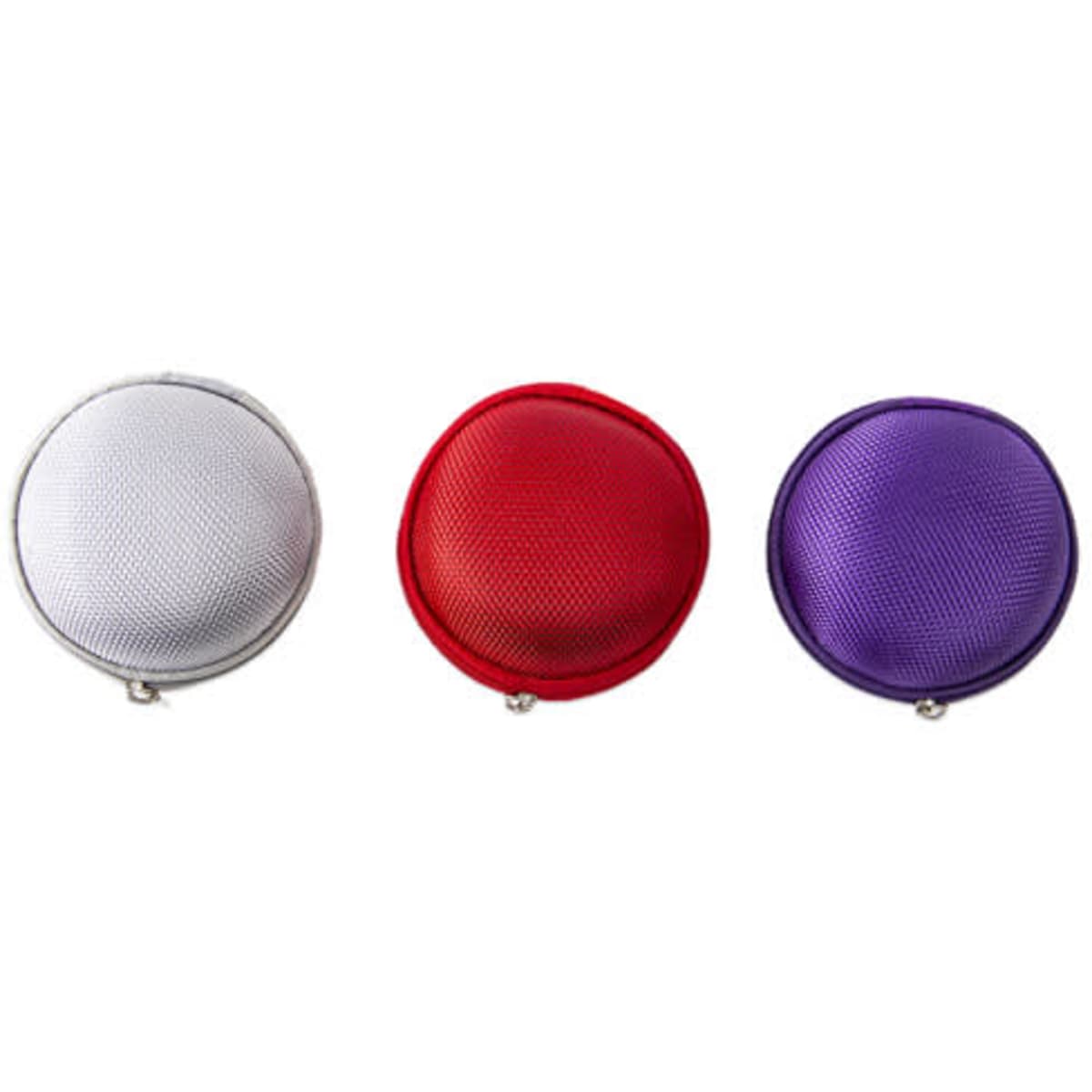 A custom round essential oil case in silver, red, and purple, featuring a zipped closure and a textured surface.