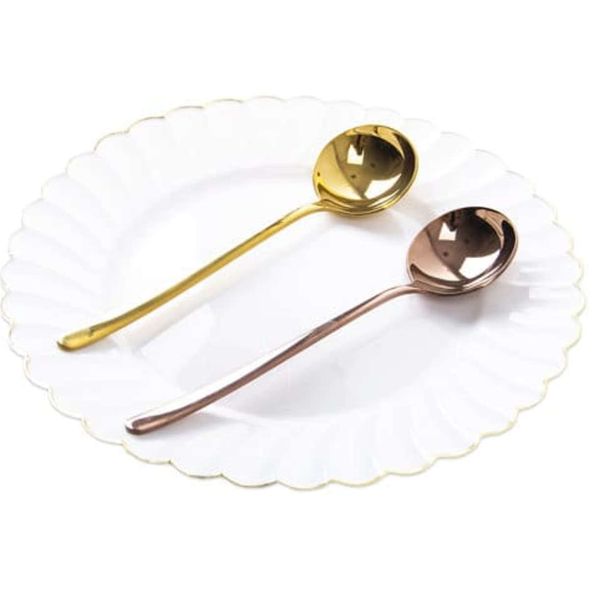 A white plate holds a stainless steel golden round spoon and a rose gold spoon, both showcasing a polished finish.