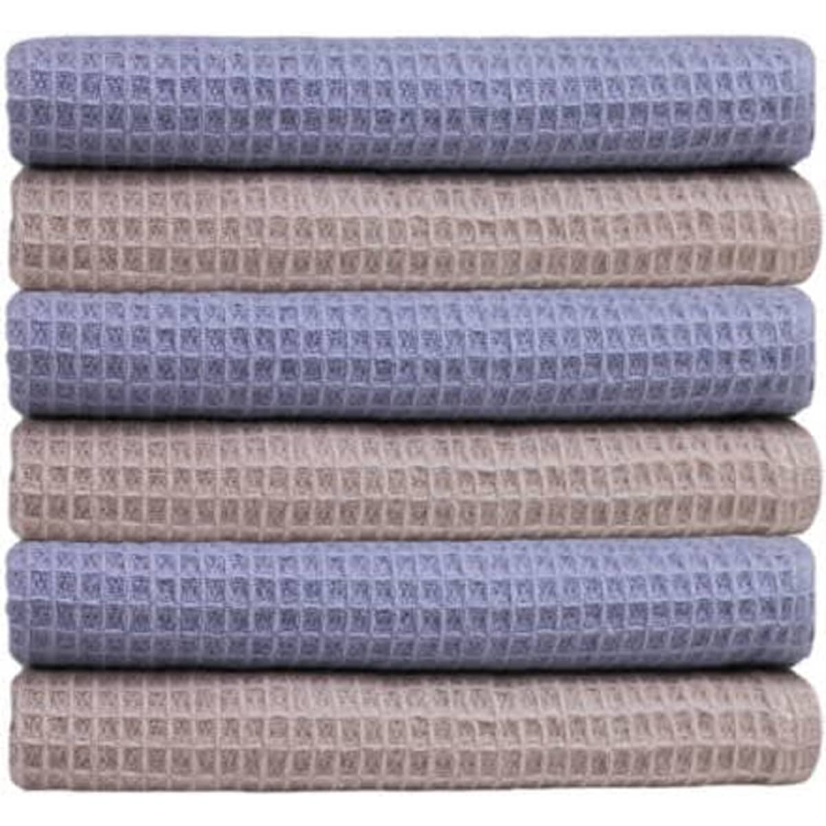 A stack of waffle absorbent cotton kitchen towels in shades of blue and beige, featuring a textured pattern.