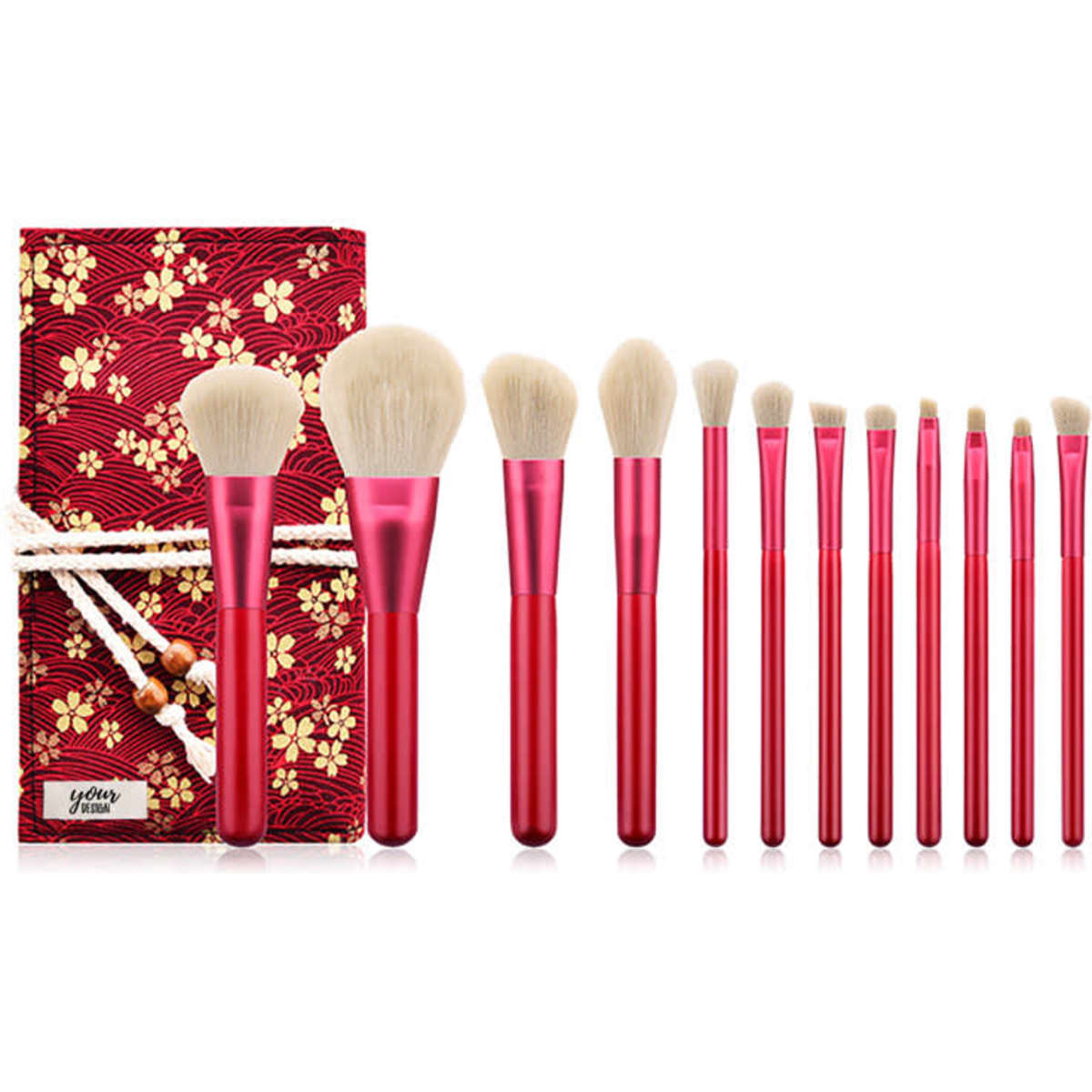 A 12-piece makeup brush set with red handles, featuring various brush shapes, displayed in a decorative box.