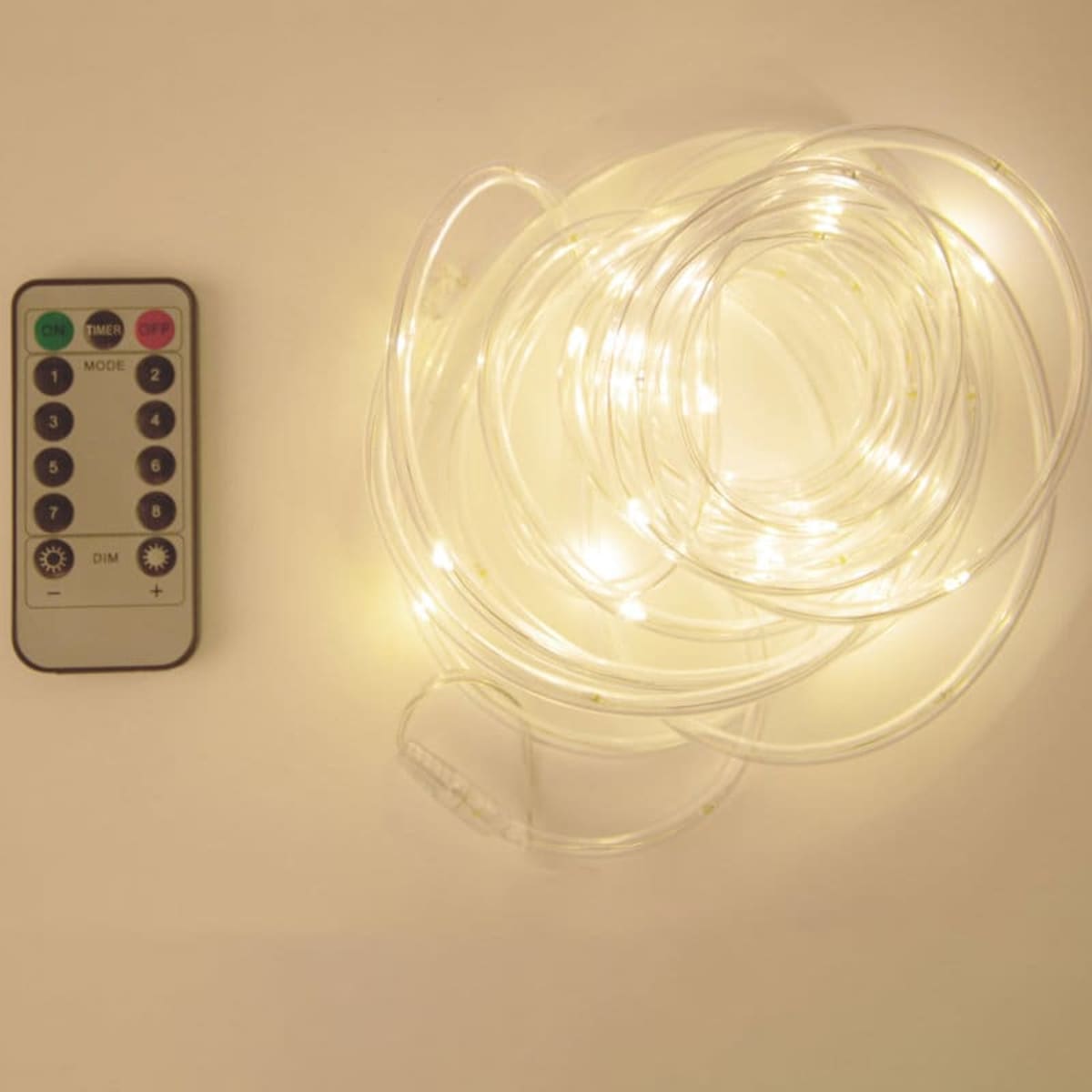 LED string lights in warm white with a remote control, featuring a clear design for versatile home décor.