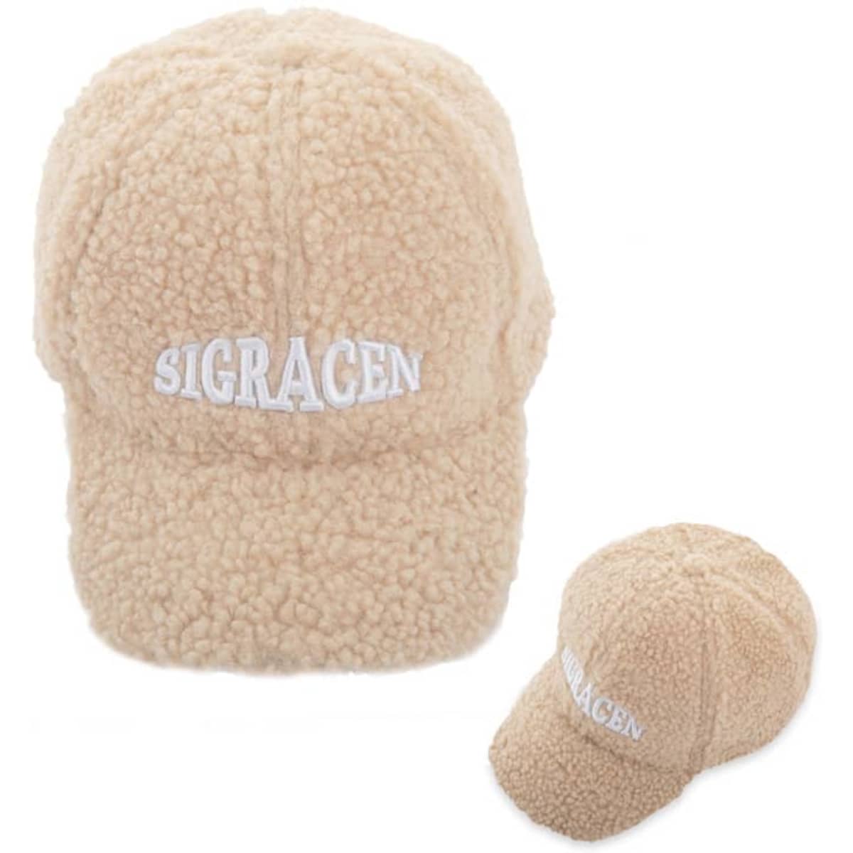 A personalised lamb wool baseball cap in a soft beige colour, featuring a logo on the front.