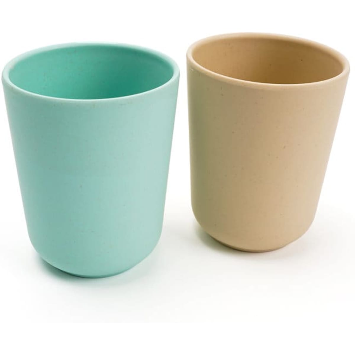 A drinkware set featuring two reusable coffee cups in mint green and light beige, made from bamboo fibre. Each cup has a smooth finish and a simple design.