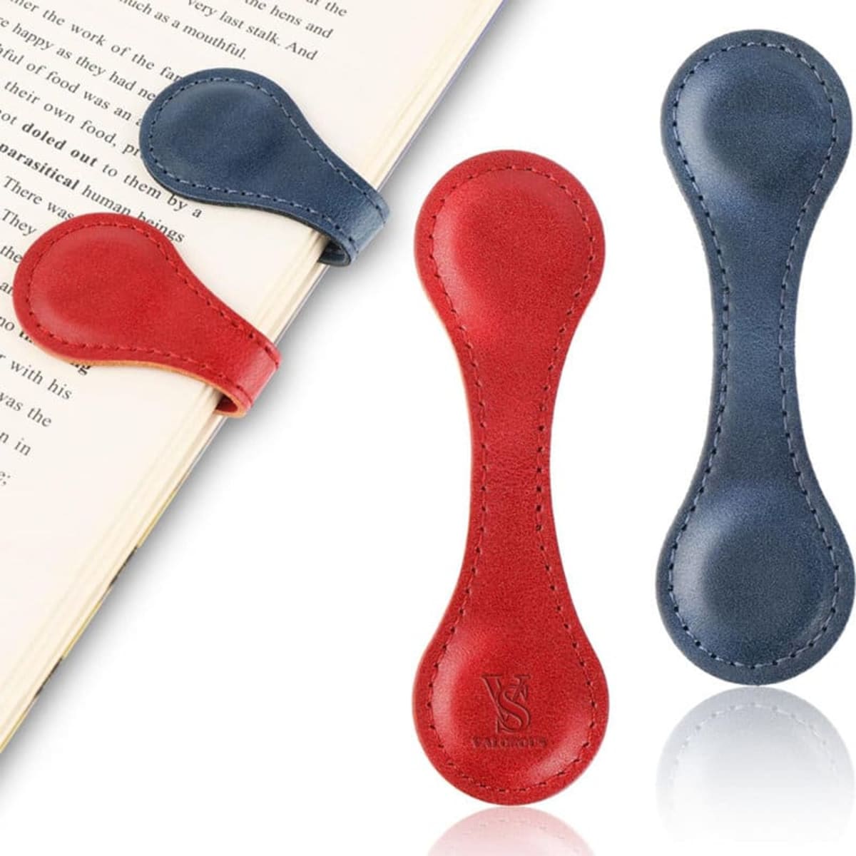 Two PU leather magnetic bookmarks in red and navy blue, each with a smooth finish, positioned on an open book.