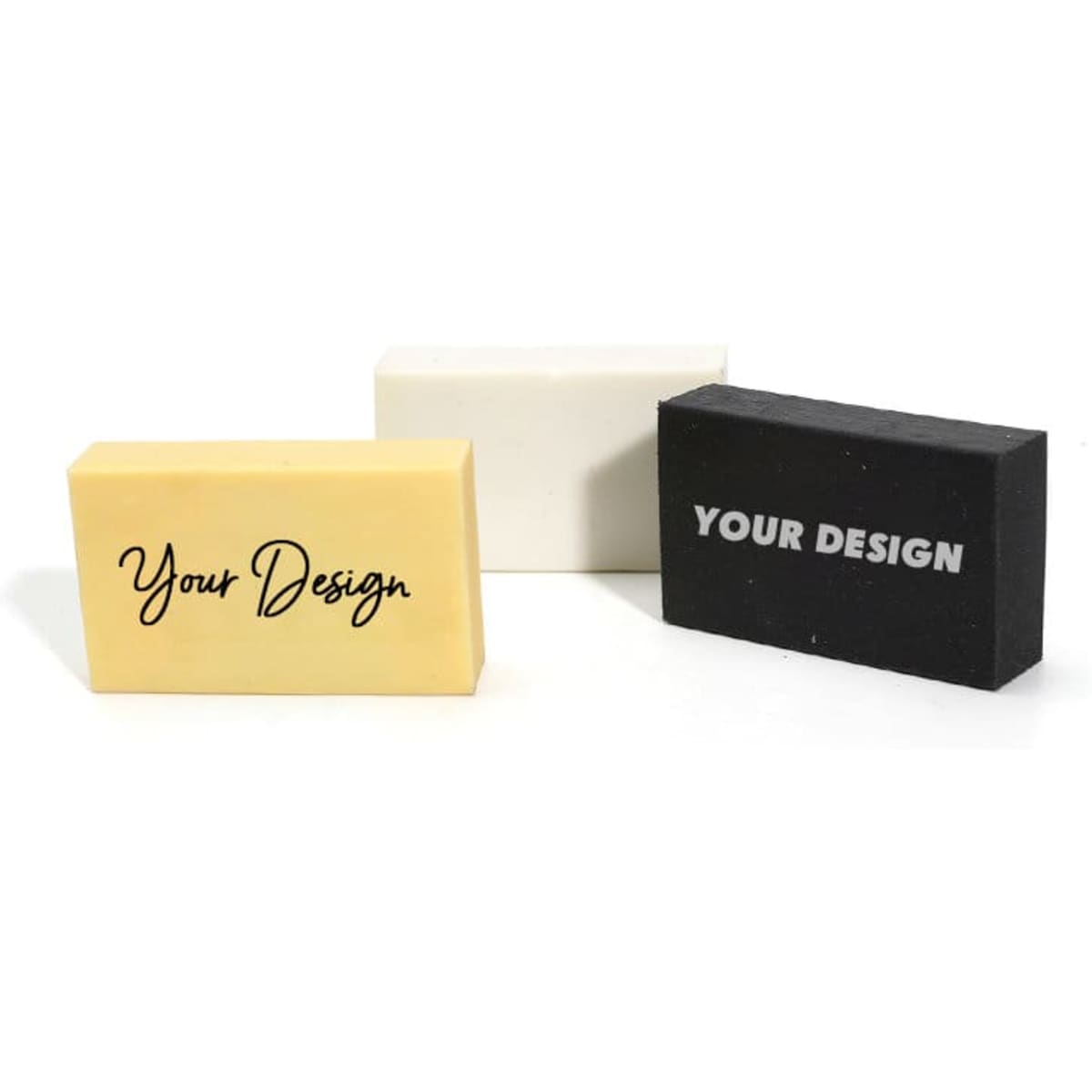 Three rectangular pencil erasers in yellow, white, and black, featuring different design options on the surface.