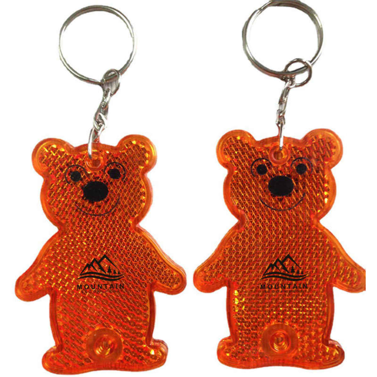 An orange bear-shaped reflective pendant keyring with a silver keyring attachment. It features a simple bear design and a logo.