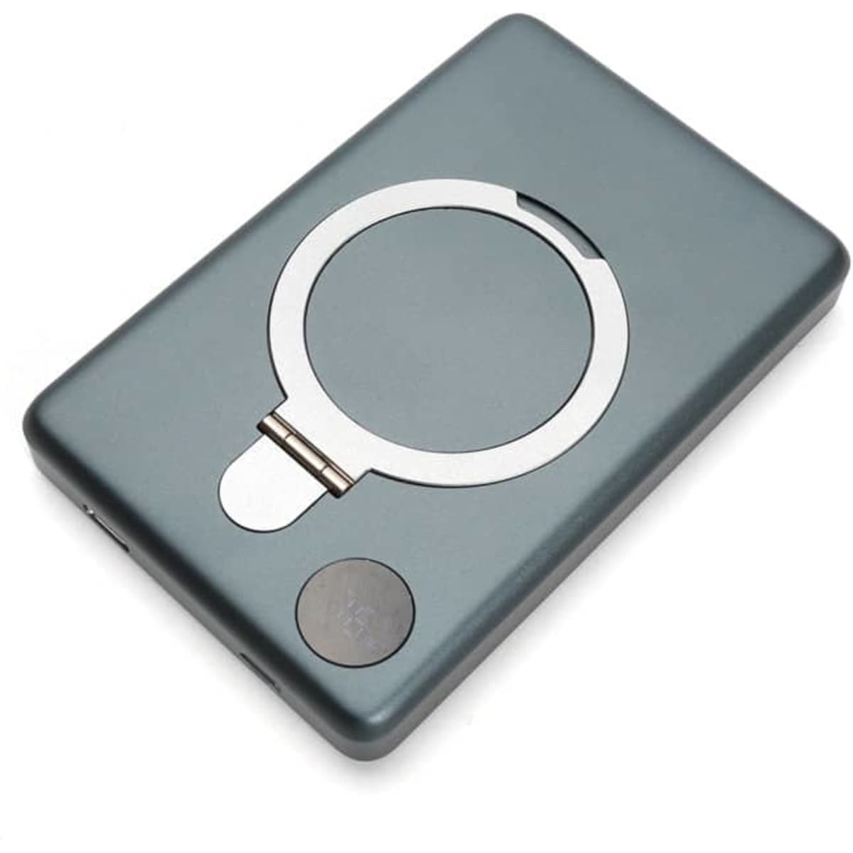 A grey magnetic portable power bank with a circular attachment and a small logo on the surface.