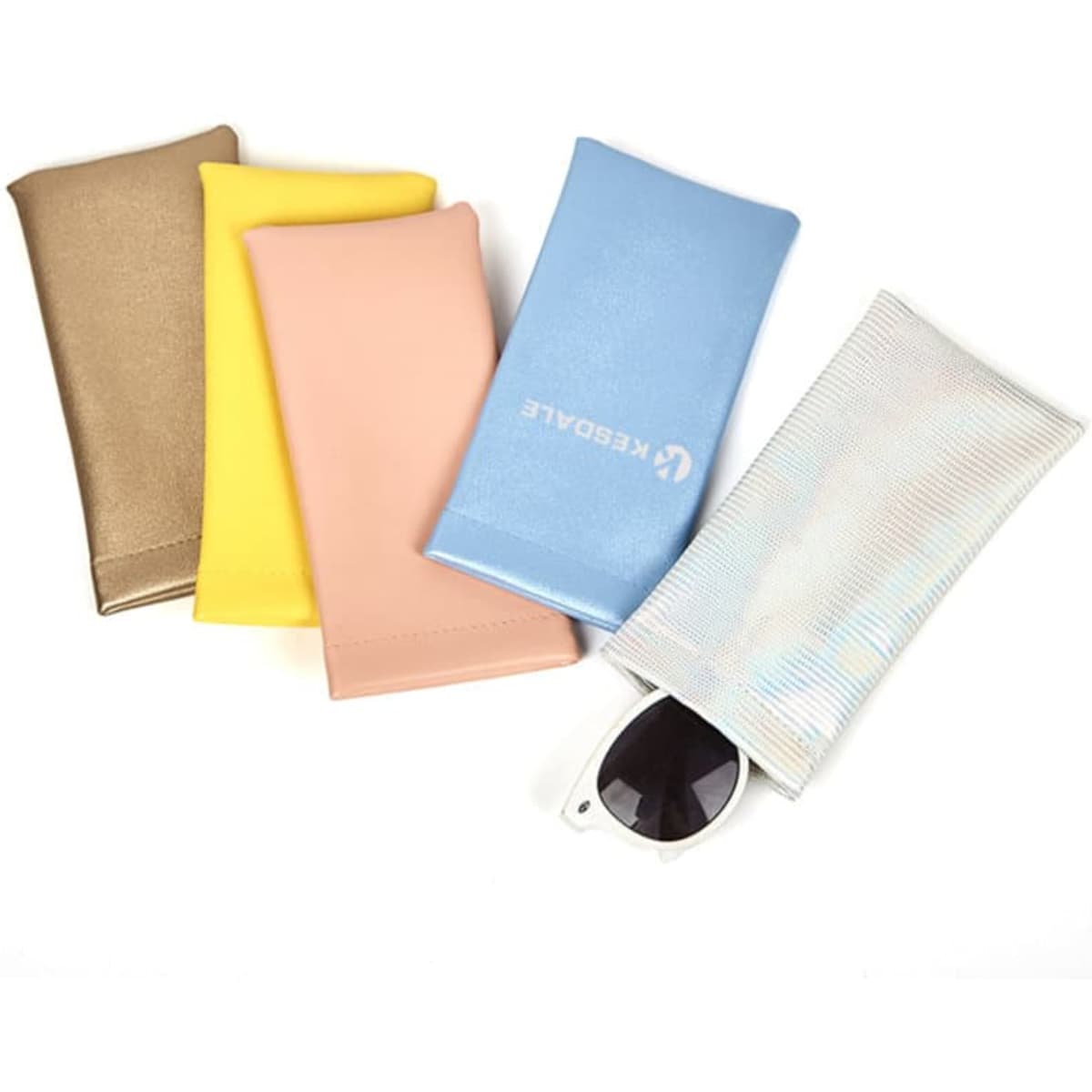 A selection of PVC leather pouches in gold, yellow, pink, blue, and iridescent, with sunglasses partially visible in one.