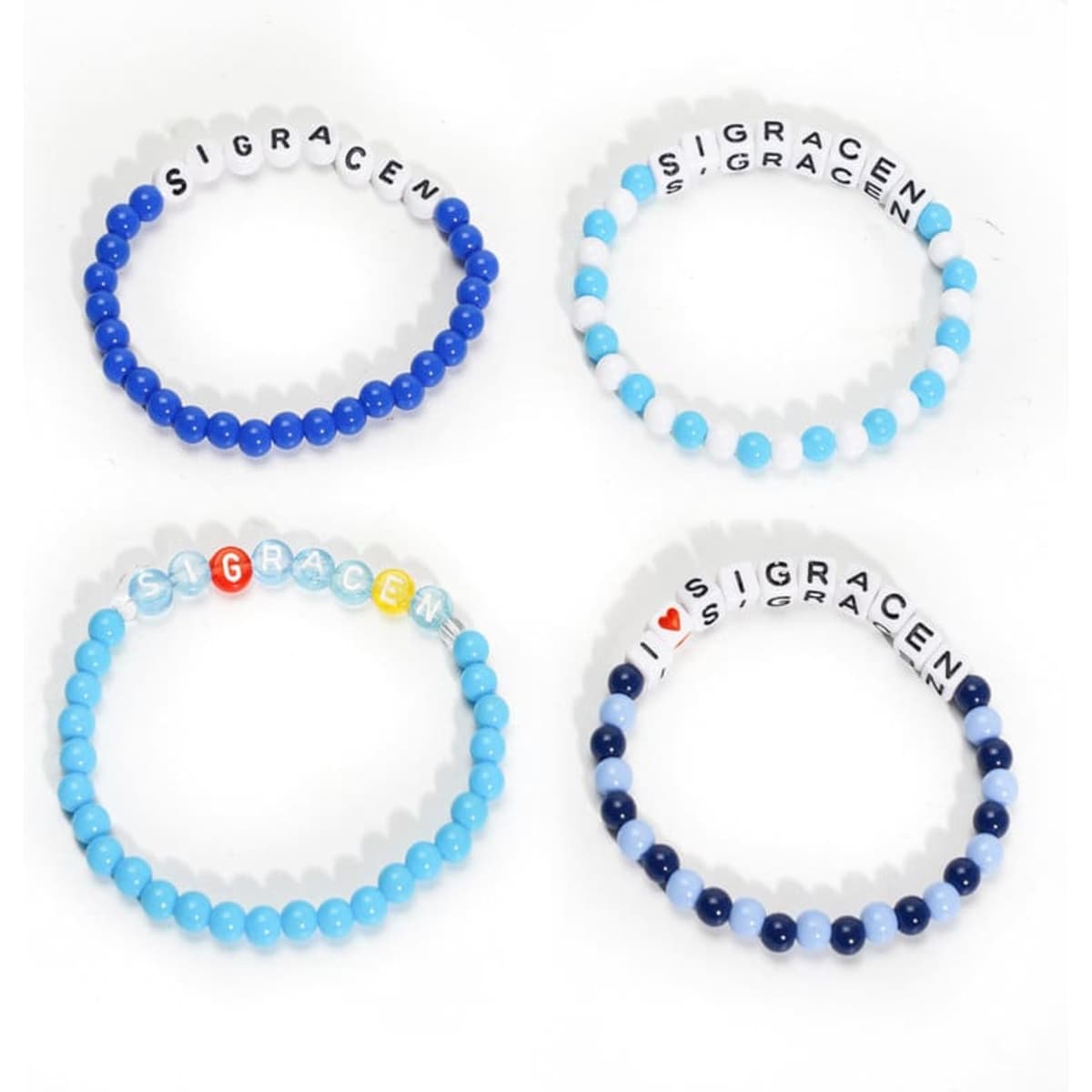 Four handmade bead bracelets in various shades of blue, featuring white letter beads and one multicoloured bead.